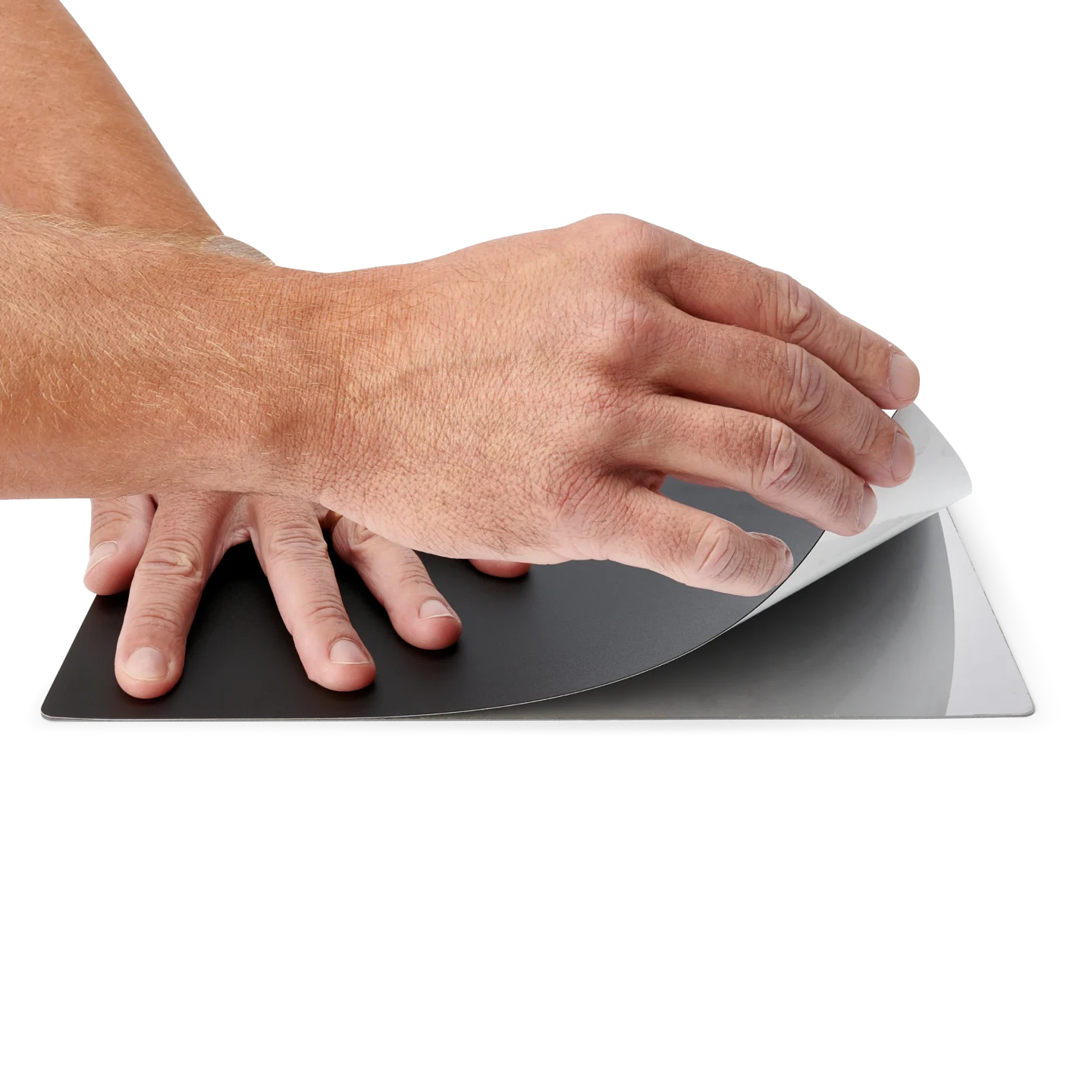 Hands applying the A4 sized insulation cover on the large baseplate (PCBITE-4017)