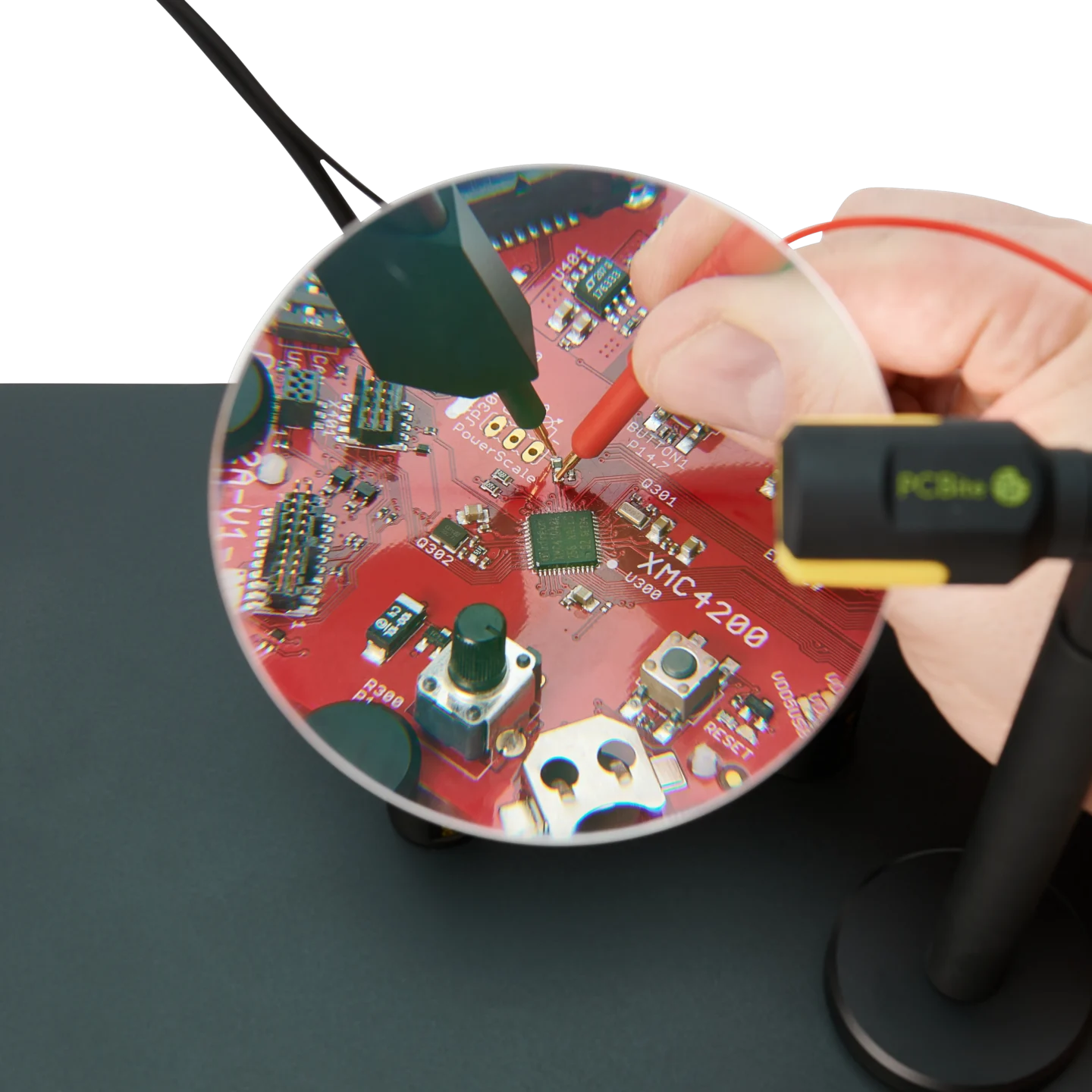 Hand measuring on small PCB components visible through the AR coated 3x magnifying lens (PCBITE-4020)