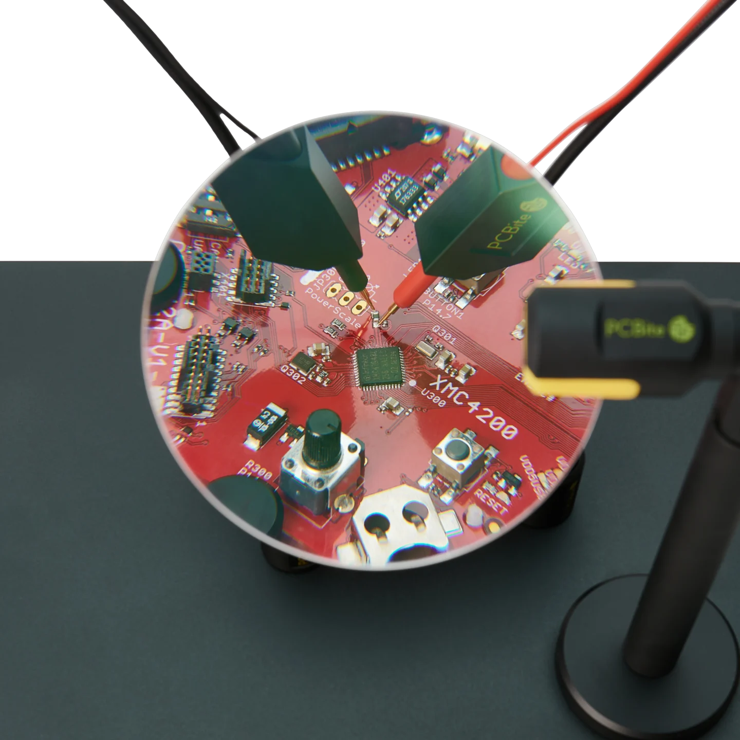 Two probes are placed on PCB under test visible through the magnifying lens of magnifier (PCBITE-4020)