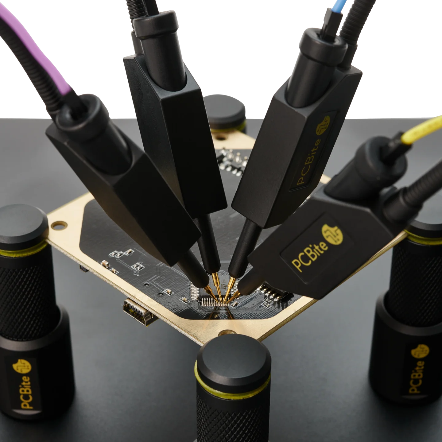 Four handsfree SQ10 probes with spring-loaded tips probing PCB signals simultaneously (PCBITE-6005)