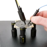Two SQ10 probes one used handsfree and the other handheld to measure the PCB under test (PCBITE-6005)