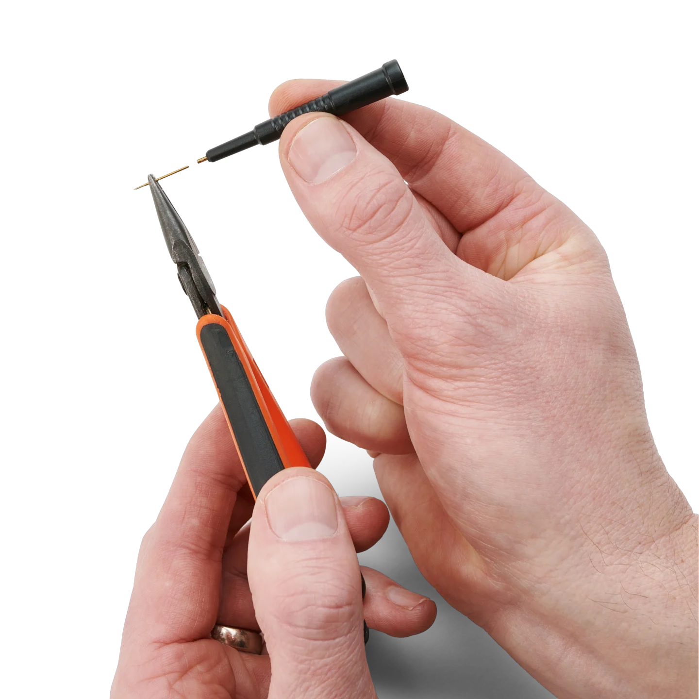 Hands showing how to change the replaceable spring-loaded test needle of the SQ10 probe (PCBITE-6005)
