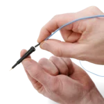 Hand showing how to connect a dupont test wire to the SQ10 probe (PCBITE-6011)