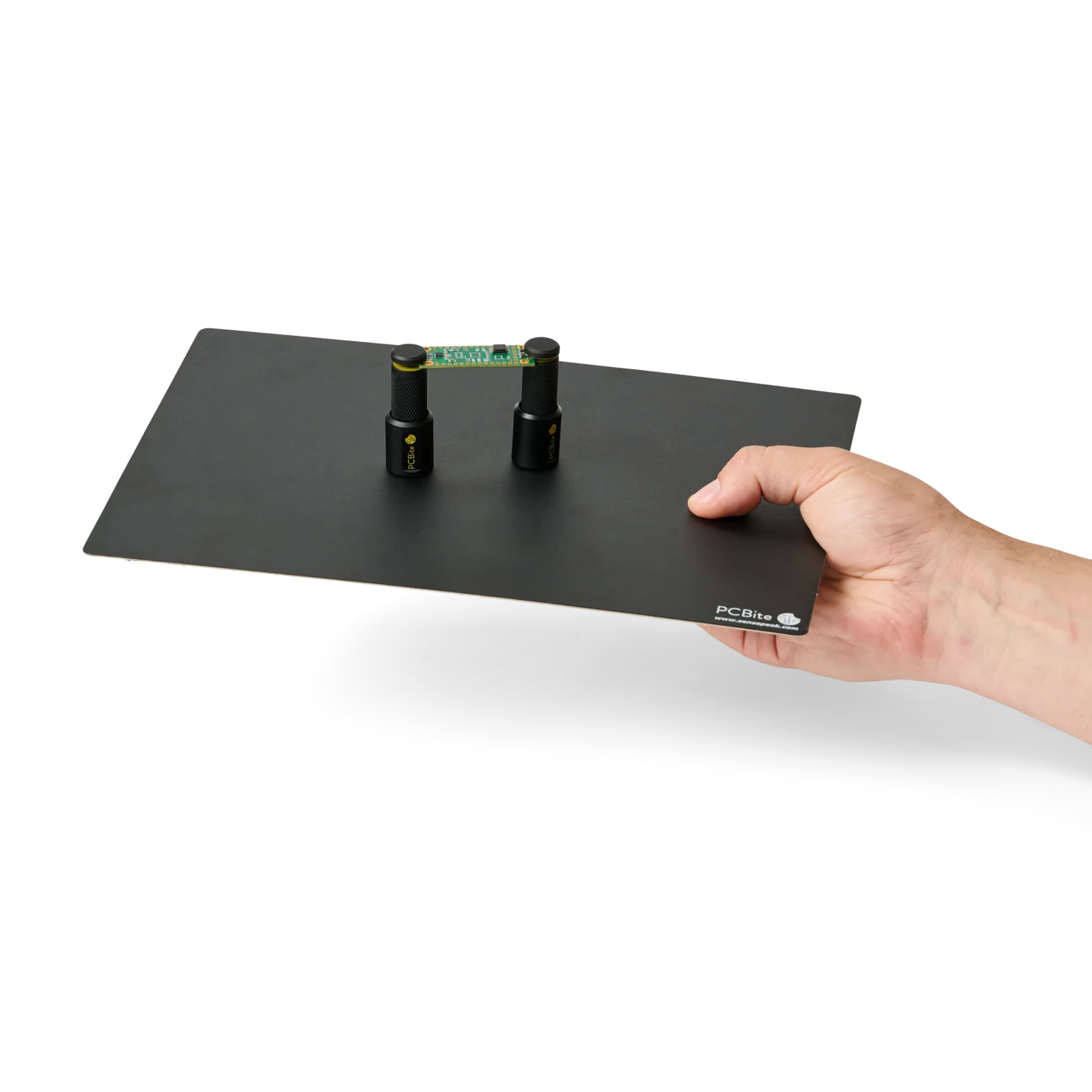 SQ200 200 MHz, Hand handing over a setup with two spring-loaded PCB holders on a large insulated baseplate (PCBITE-6016)