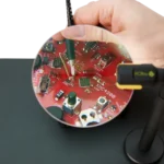 Measuring handheld on SMD component using SQ200 200 MHz oscilloscope probe with the ground spring needle (PCBITE-6019)