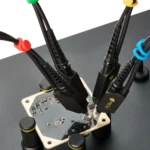 Four handsfree SQ350 350MHz oscilloscope probes measuring close signal pins on MCU test PCB (PCBITE-6023)