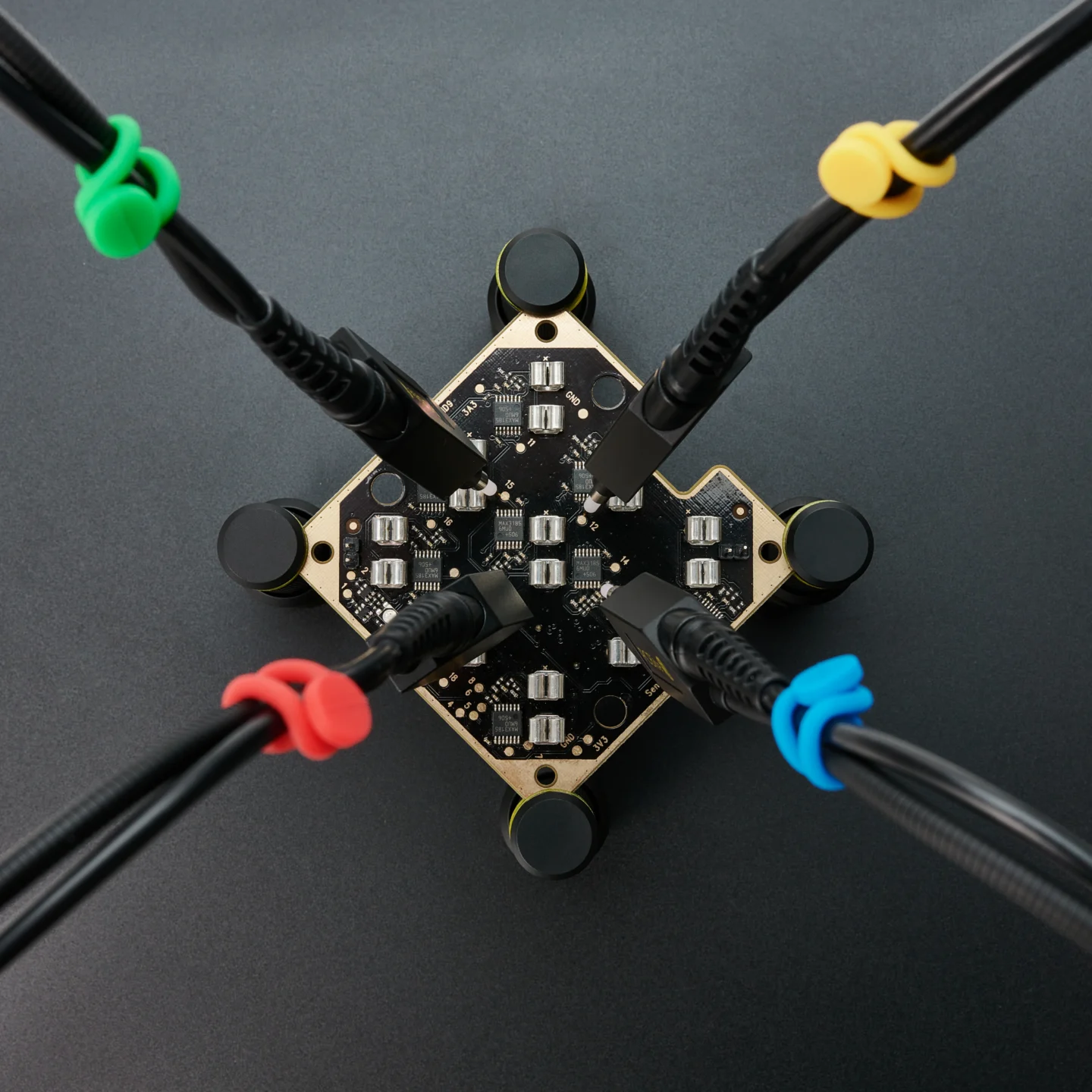 Four handsfree SQ350 350MHz probes measuring on different PCB testpoints with color-coded cable holders (PCBITE-6023)