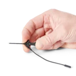 Hand showing the airplane test hook with attached 10cm dupont cable (PCBITE-7004)