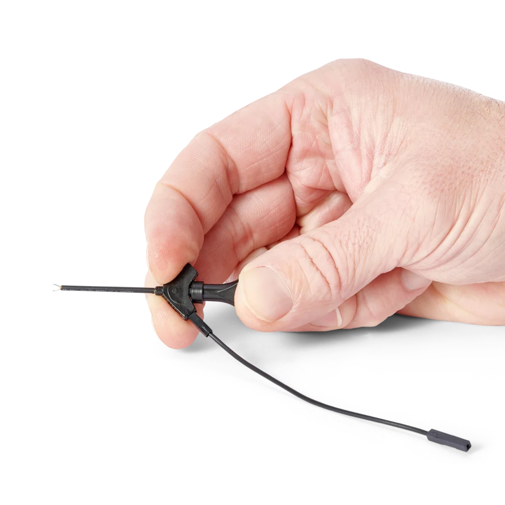Hand showing the airplane test hook with attached 10cm dupont cable (PCBITE-7004)