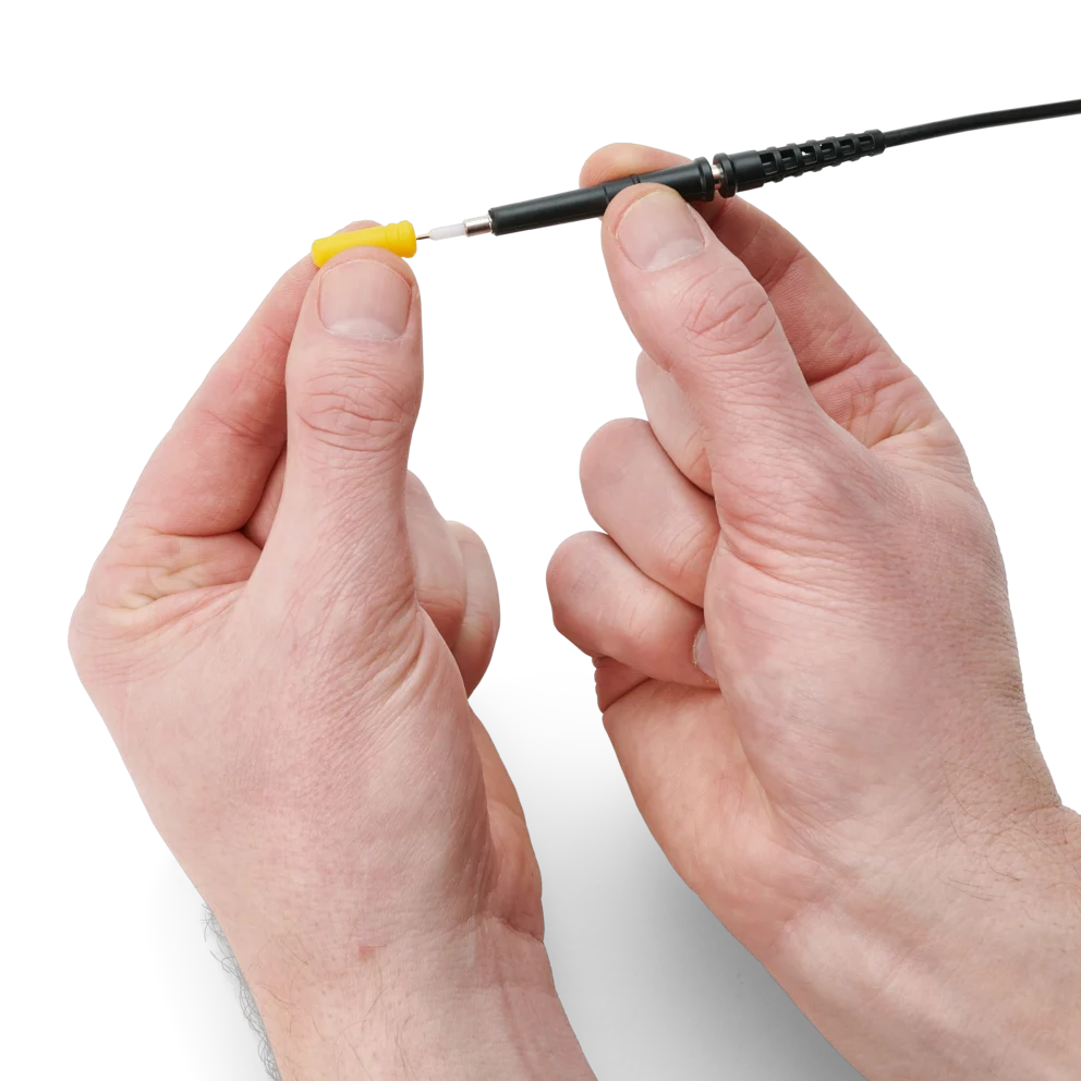 Hand showing how to mount or dismount the probe protection from the oscilloscope probe (PCBITE-7007)