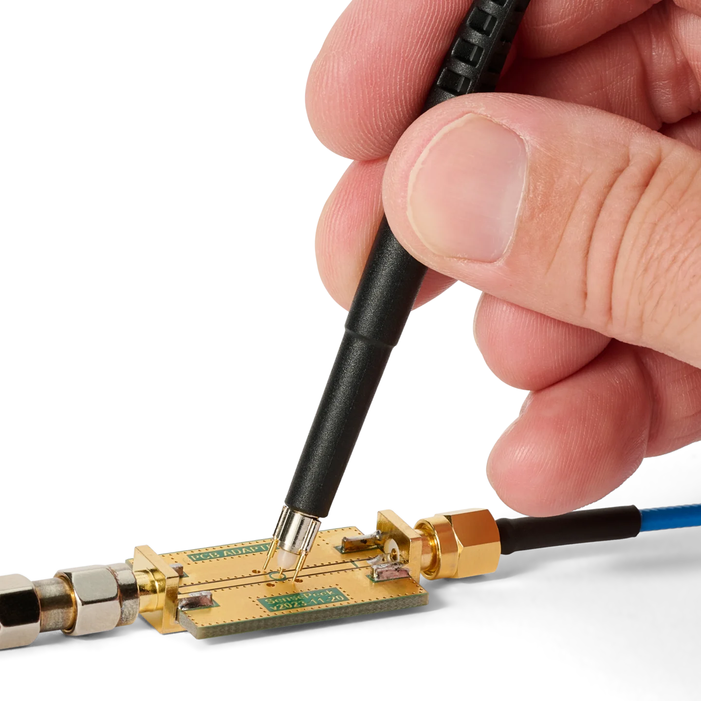 Hand measuring on PCB using SQG30 3.0 GHz probe with mounted dual ground spring (PCBITE-7010)