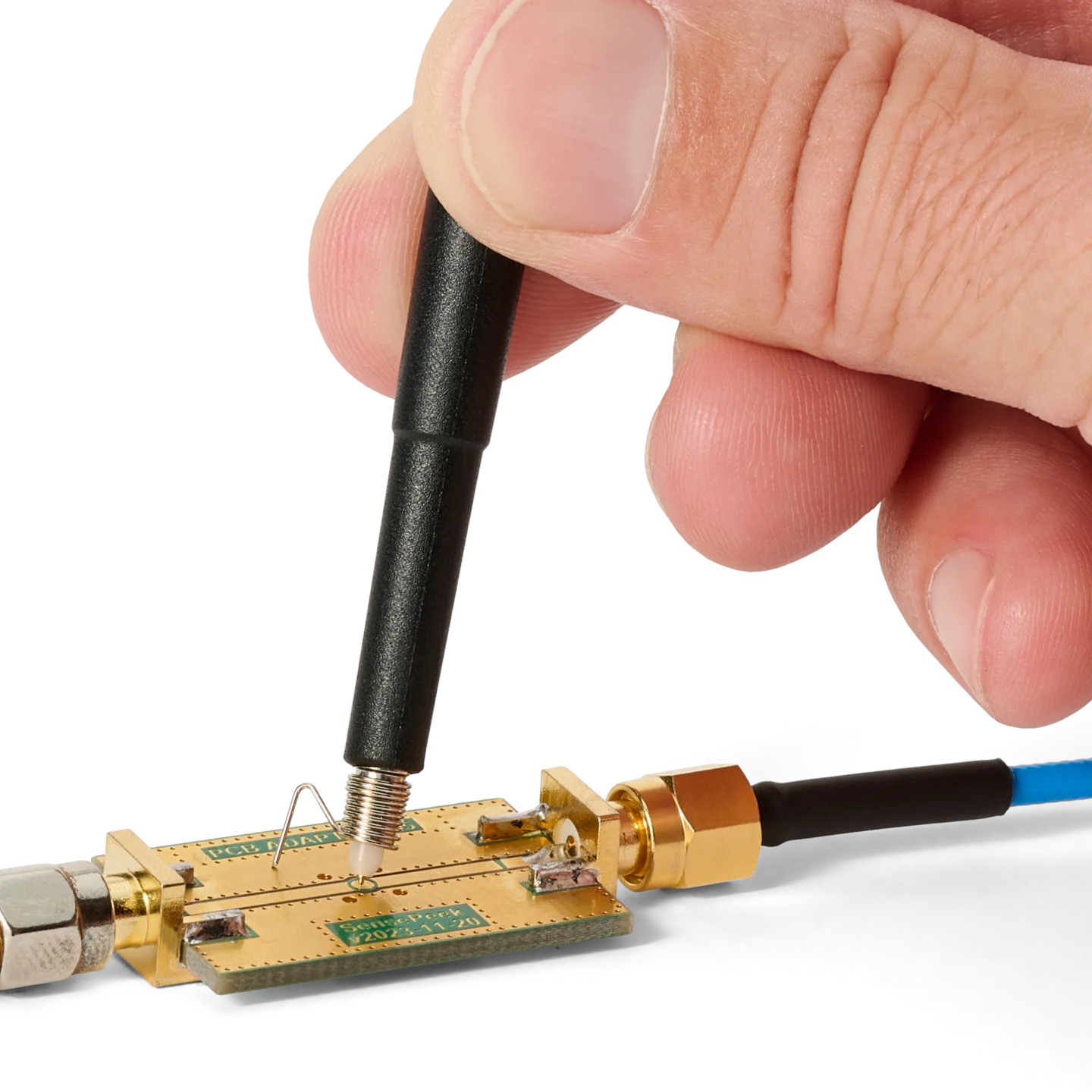 Hand measuring on RF PCB using SQG30 3.0 GHz probe with ground spring for handheld measuring (PCBITE-7010)