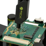 Handsfree SQG30 3.0 GHz probe with ground needle measuring live signal on populated PCB (PCBITE-7010)