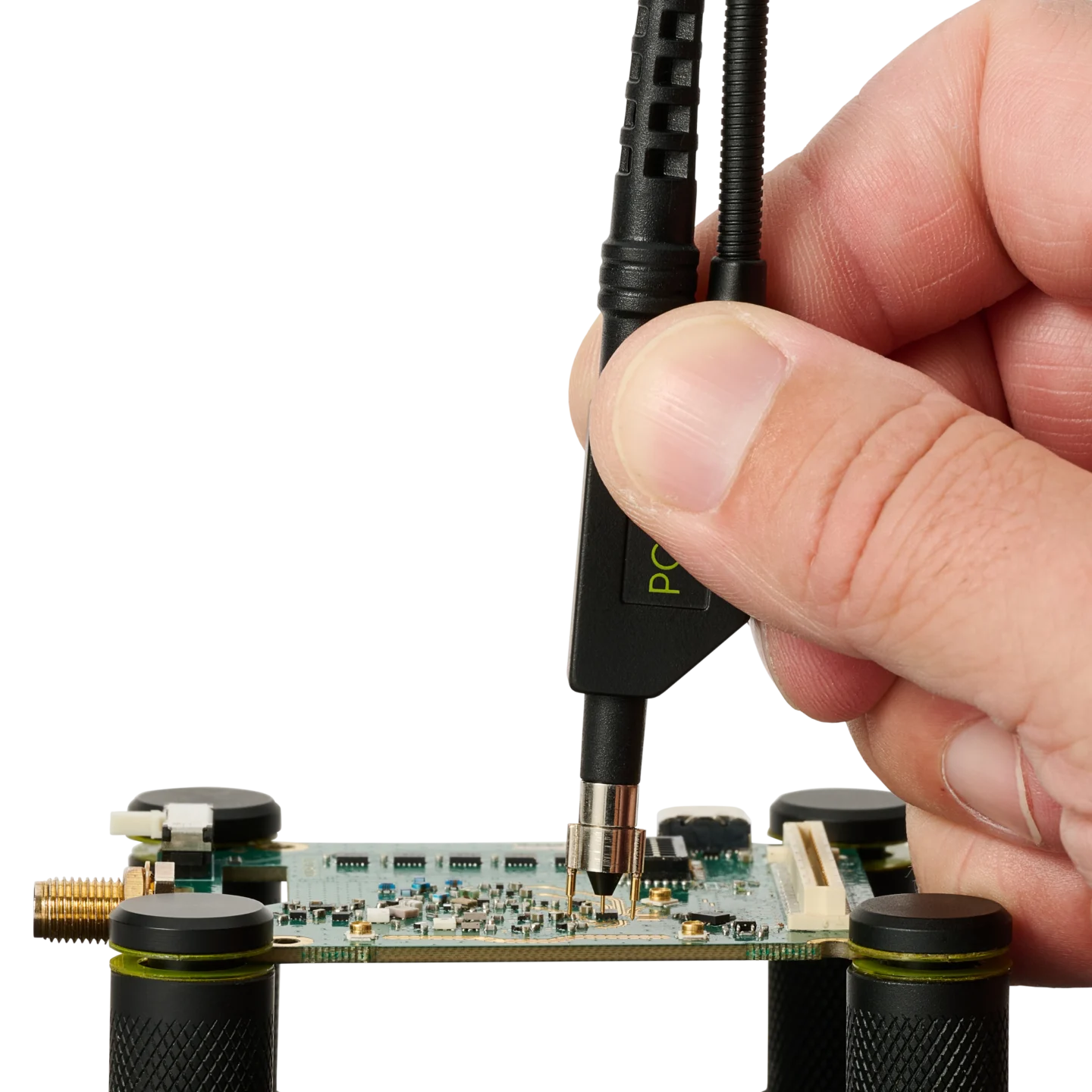 Hand placing a SQG60 6.0 GHz probe on PCB track for long and stable test (PCBITE-7012)