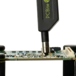 Handsfree SQG60 6.0 GHz probe measuring high-speed signal on PCB with dual ground option (PCBITE-7012)