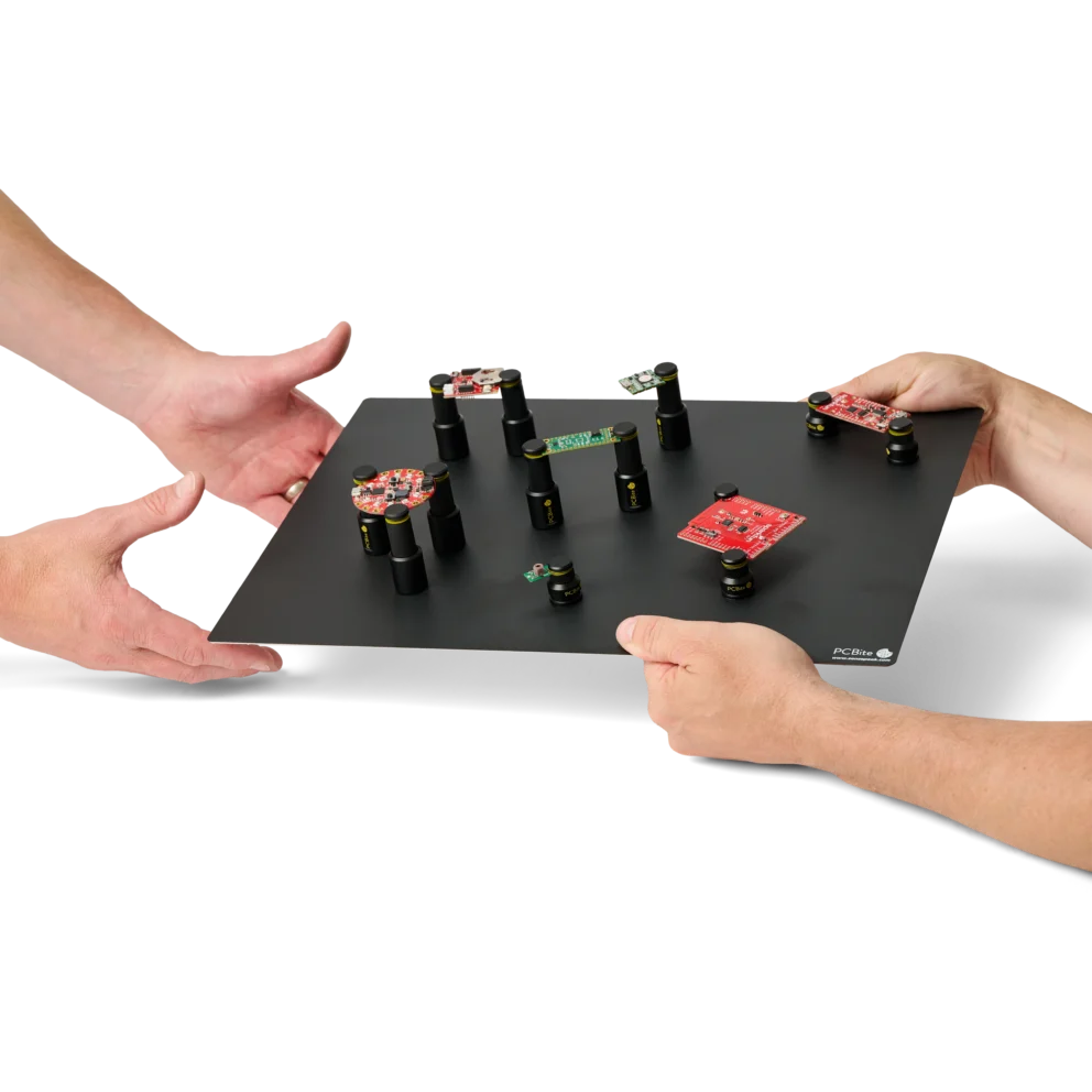 Thirteen mixed low profile and standard height PCB holders securing various boards on XL baseplate (PCBITE-7023)