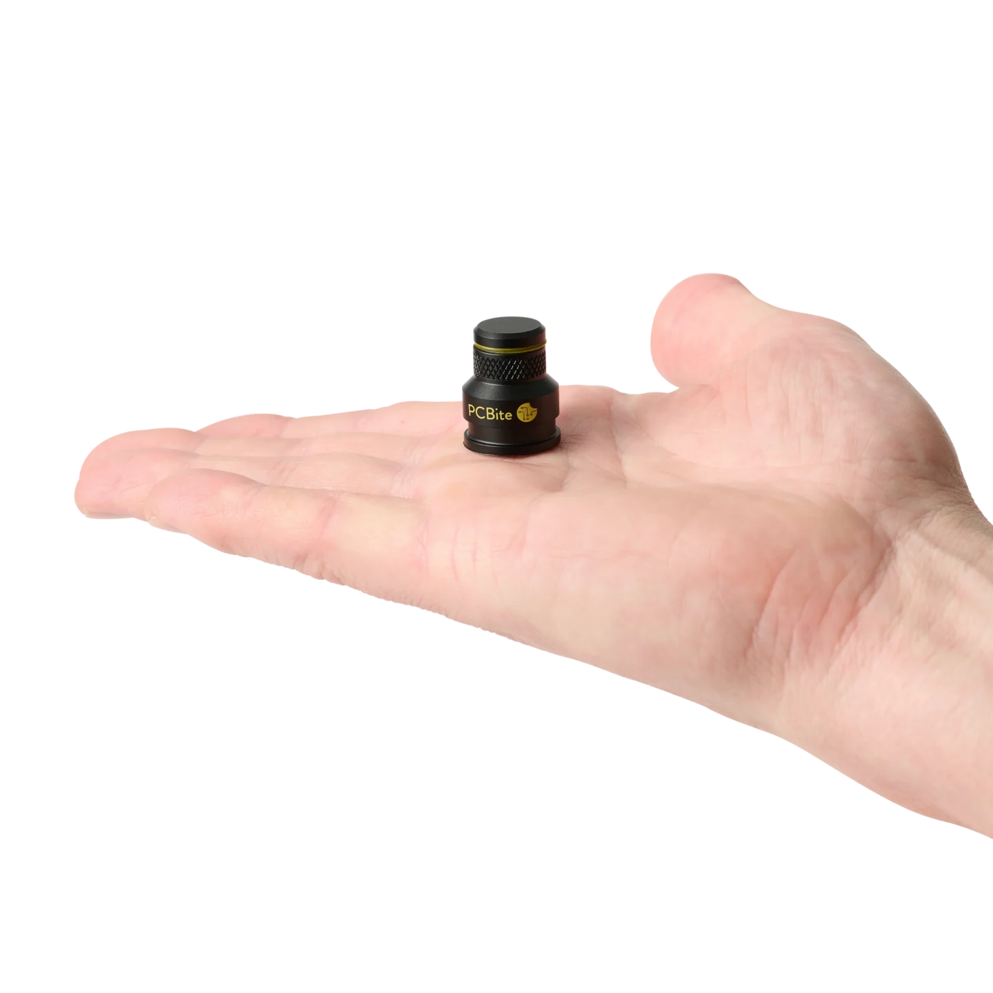 A low profile PCB holder standing in a human hand for size comparison (PCBITE-7023)