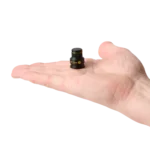 A low profile PCB holder standing in a human hand for size comparison (PCBITE-7023)