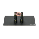 Set of four magnetic spring-loaded PCB holders on a small insulated baseplate holding a PCB (PCBITE-7025)