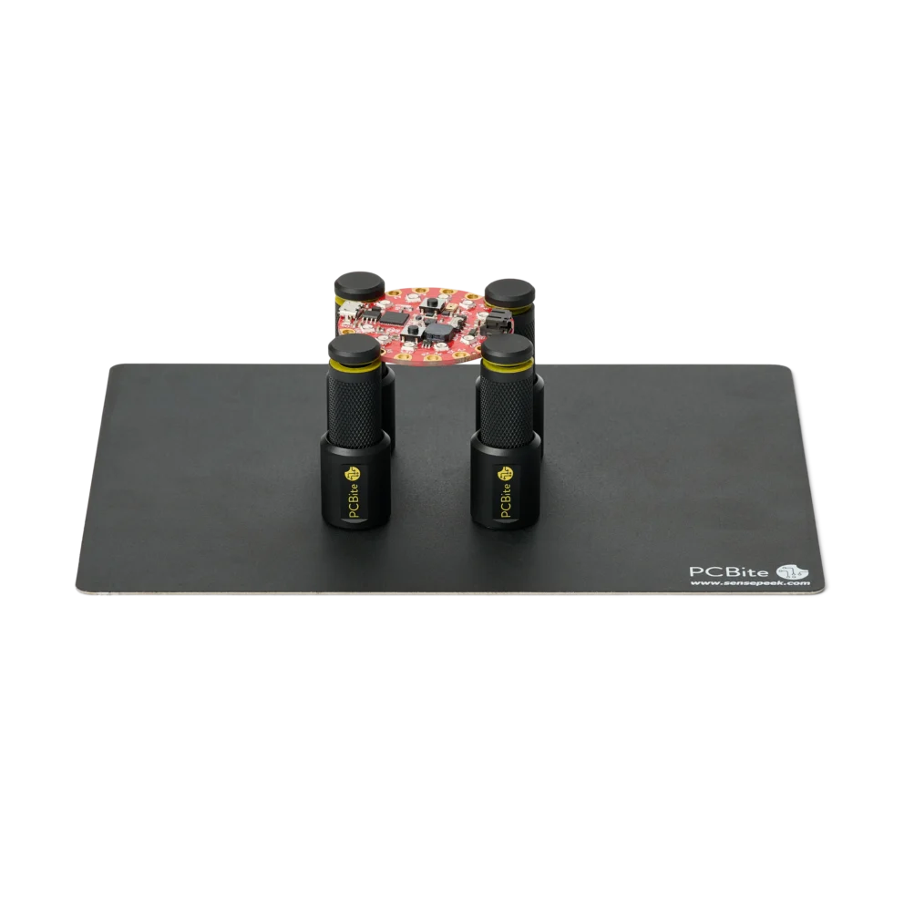 Set of four magnetic spring-loaded PCB holders on a small insulated baseplate holding a PCB (PCBITE-7025)