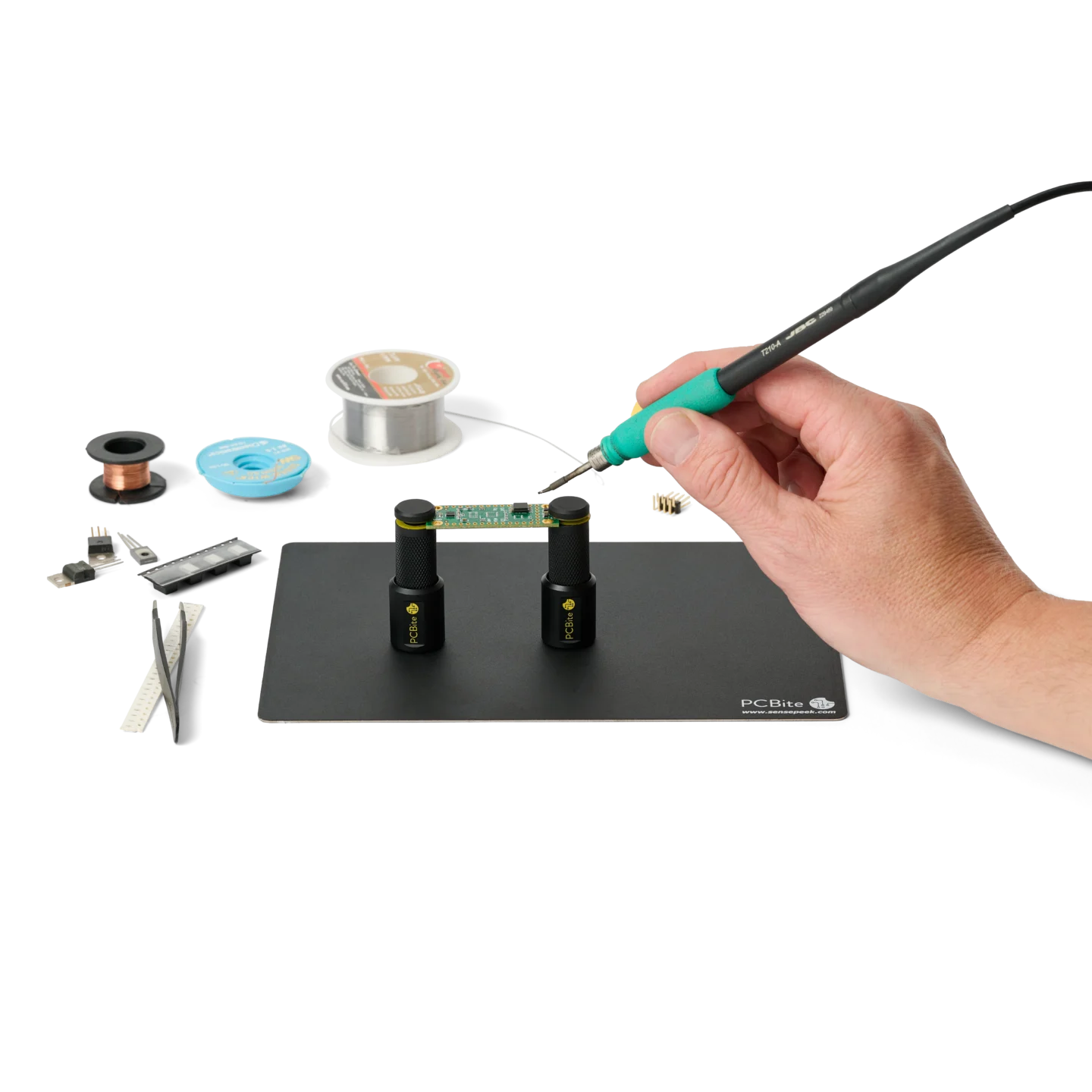 Hand soldering PCB held by two magnetic spring-loaded PCB holders on the small insulated baseplate (PCBITE-7025)