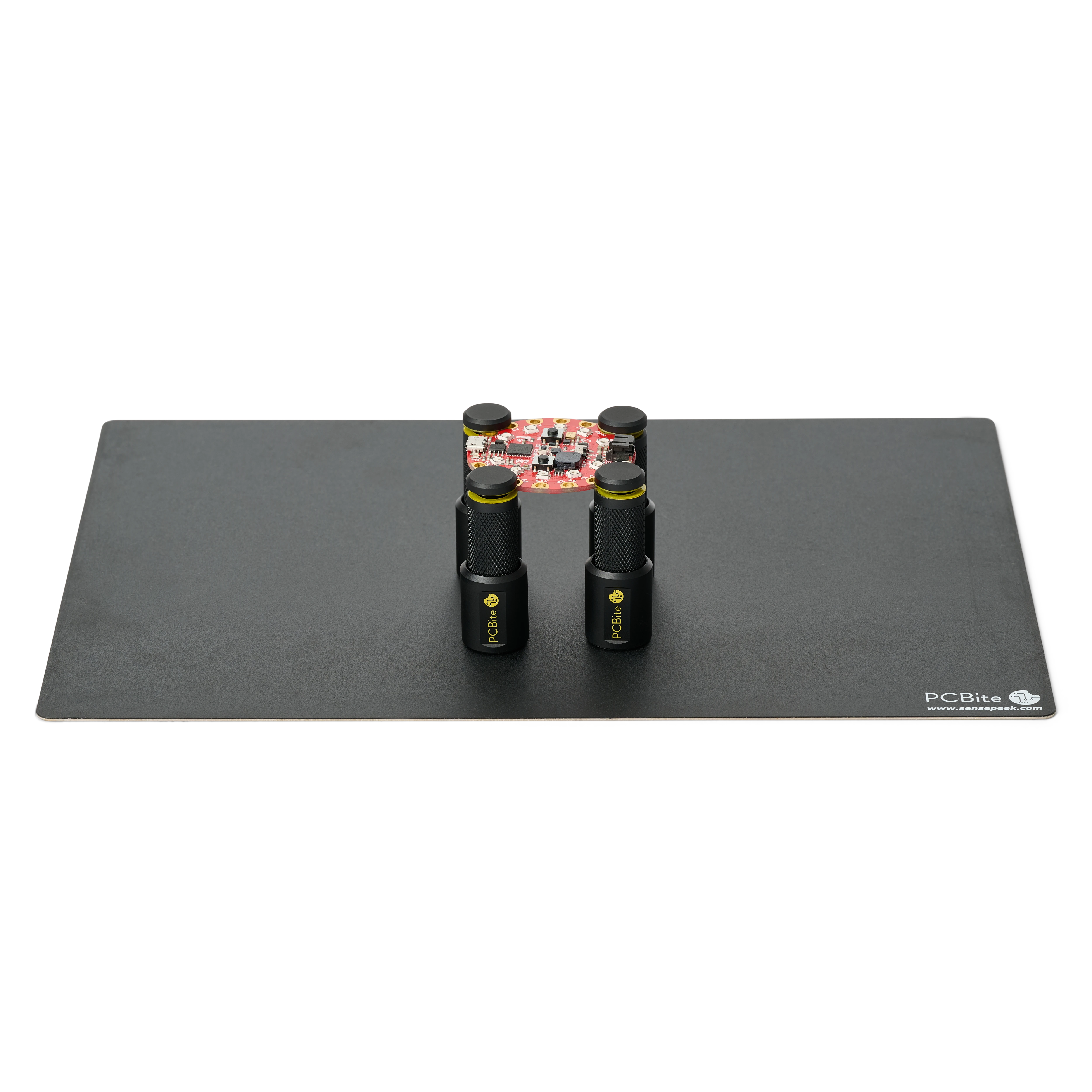 Set of four magnetic spring-loaded PCB holders on a large insulated baseplate holding a PCB (PCBITE-7026)