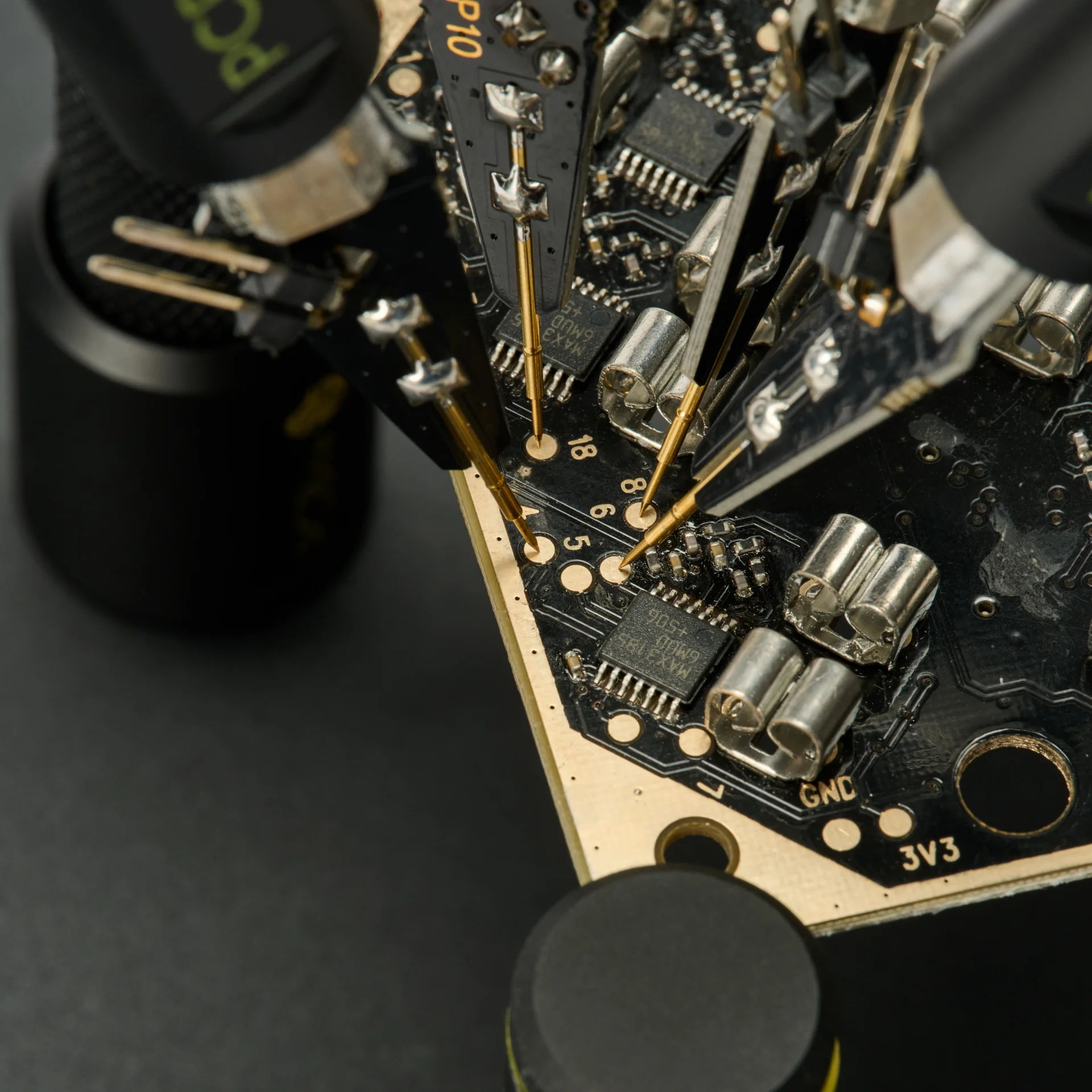 Closeup of multiple circuit board signals tested simultaneously completely handsfree using SP10 probes (PCBITE-7028)