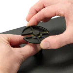 Hand opening a PCB holder and another sliding the component tray into position (PCBITE-7029)
