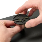 Hand closing PCB holder while another releases the component tray locked into position (PCBITE-7029)