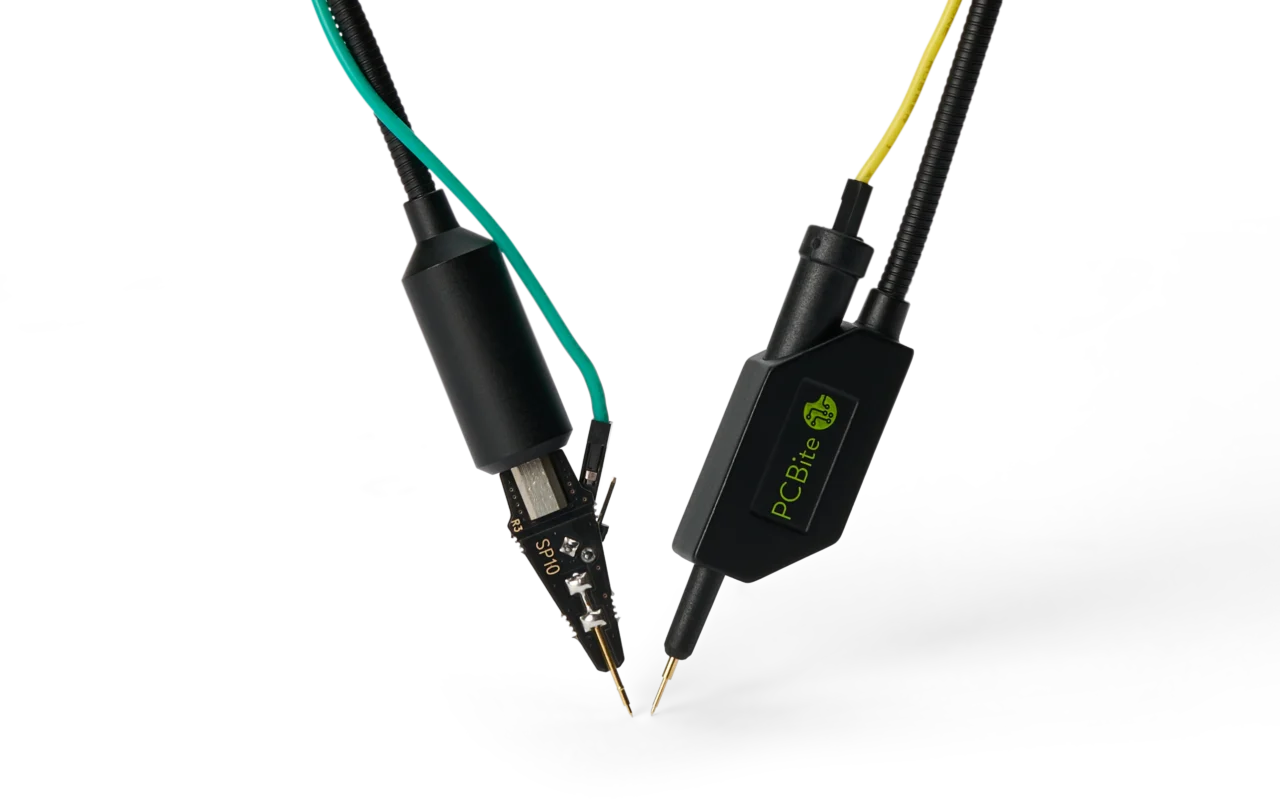 SP10 probe with its bare PCB head next to an SQ10 probe with its insulated body, both with spring-loaded needles.