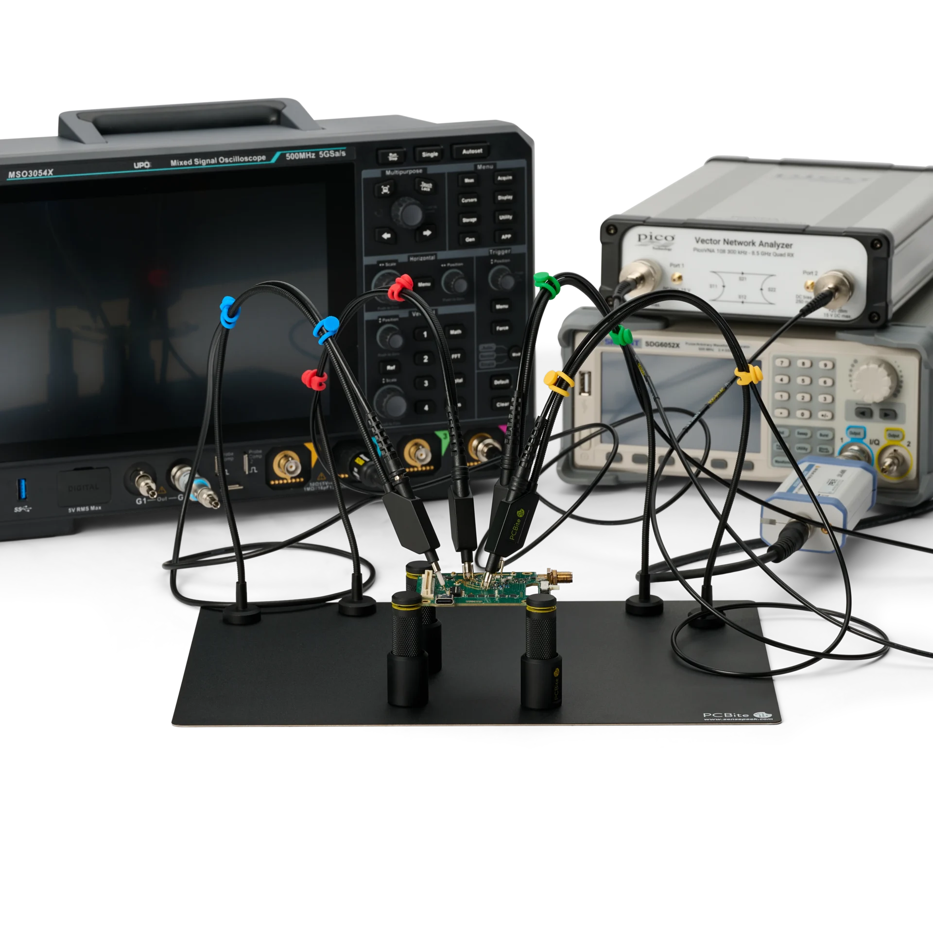 Handsfree probes on one PCB, wired to a mixed signal oscilloscope, a vector network analyzer and a signal generator.