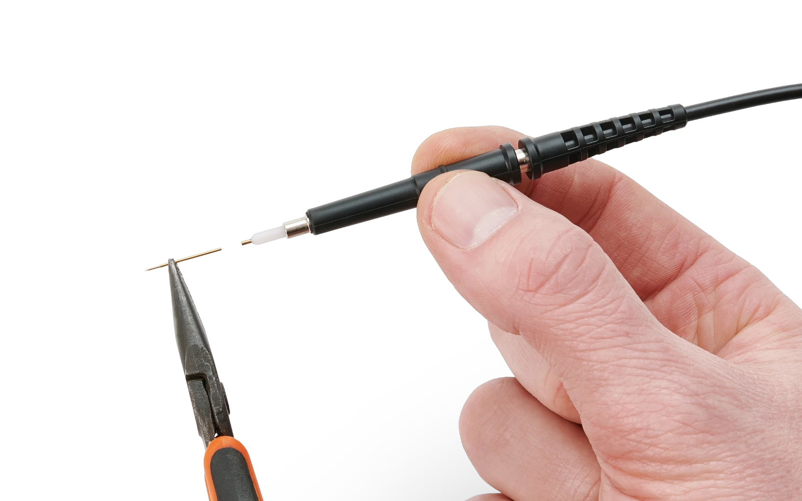 Oscilloscope probe held in one hand while pliers hold its spring-loaded test needle, showing how the needle is replaced.