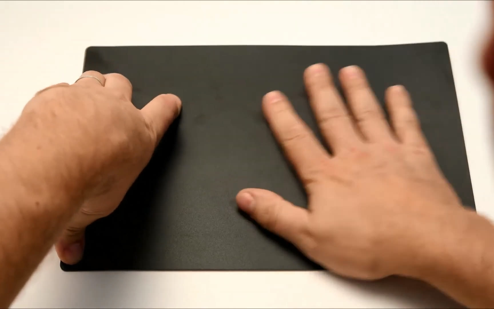 Pressing an insulation cover flat on a PCBite base plate.