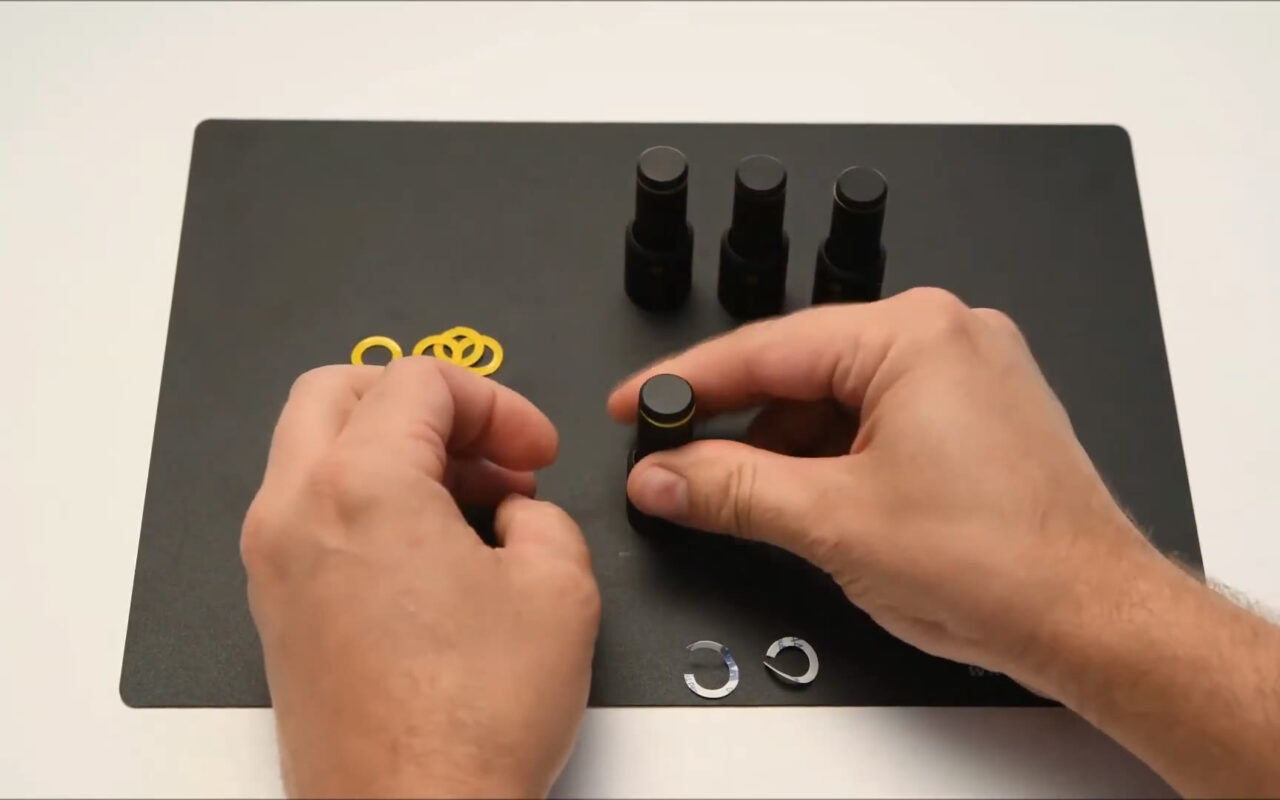 Mounting a yellow insulation washer on a PCBite holder.