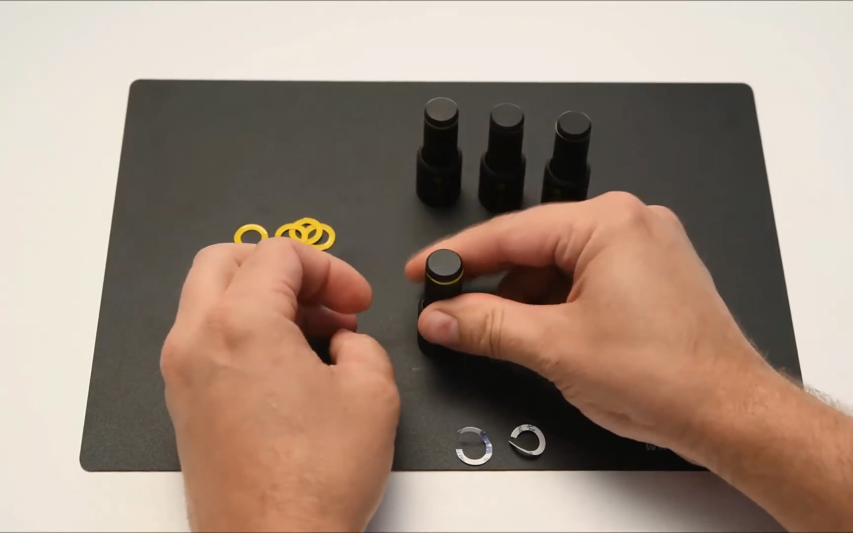 Mounting a yellow insulation washer on a PCBite holder.