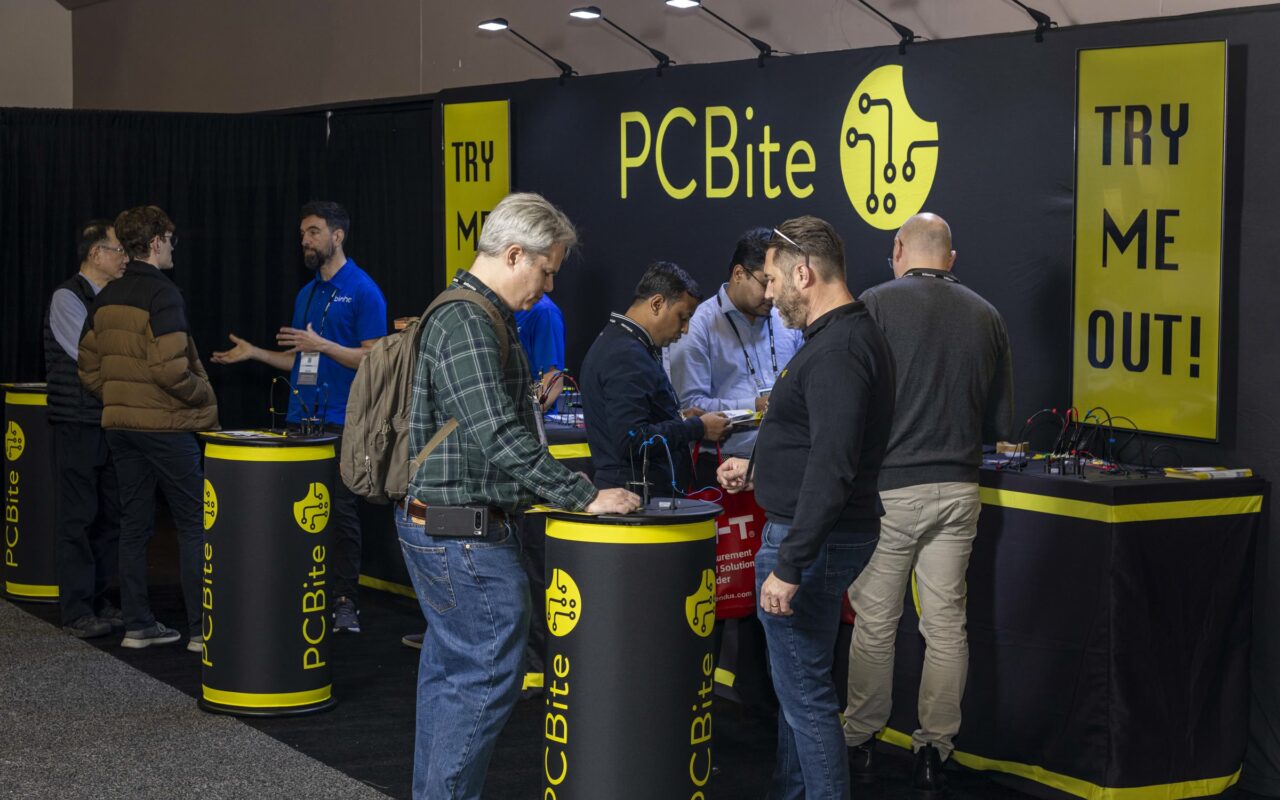 A busy PCBite booth at DesignCon 2025 in Santa Clara, with visitors trying PCBite at the demo tables.
